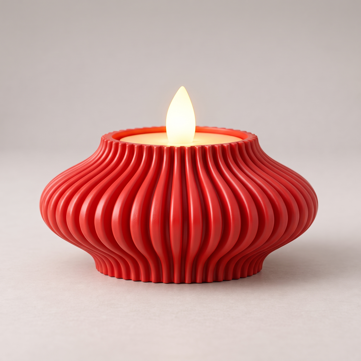 DiyArts Fluted Tealight Candle Holder in Red, sculptural ribbed fins with an LED tealight, studio product shot