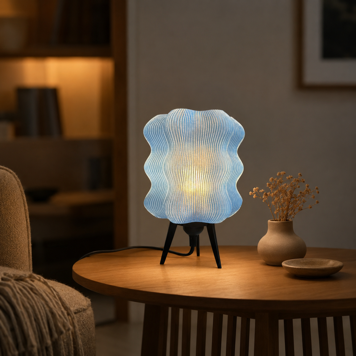 Wave Table Lamp in Light Blue on a round wooden side table