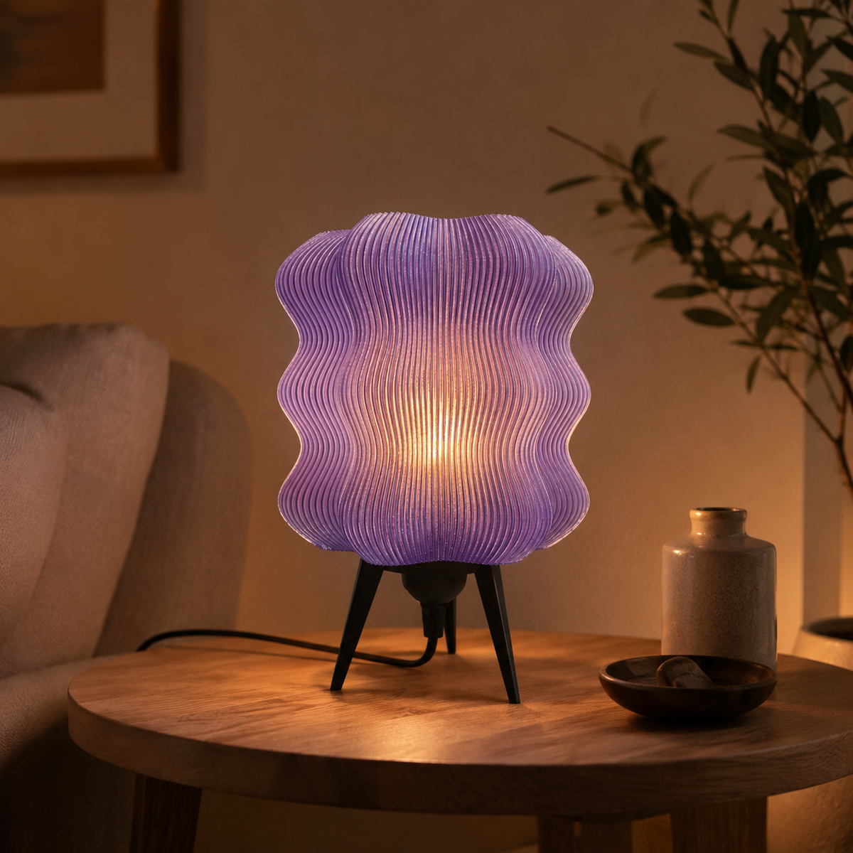 Wave Table Lamp in Purple on a wooden side table at night