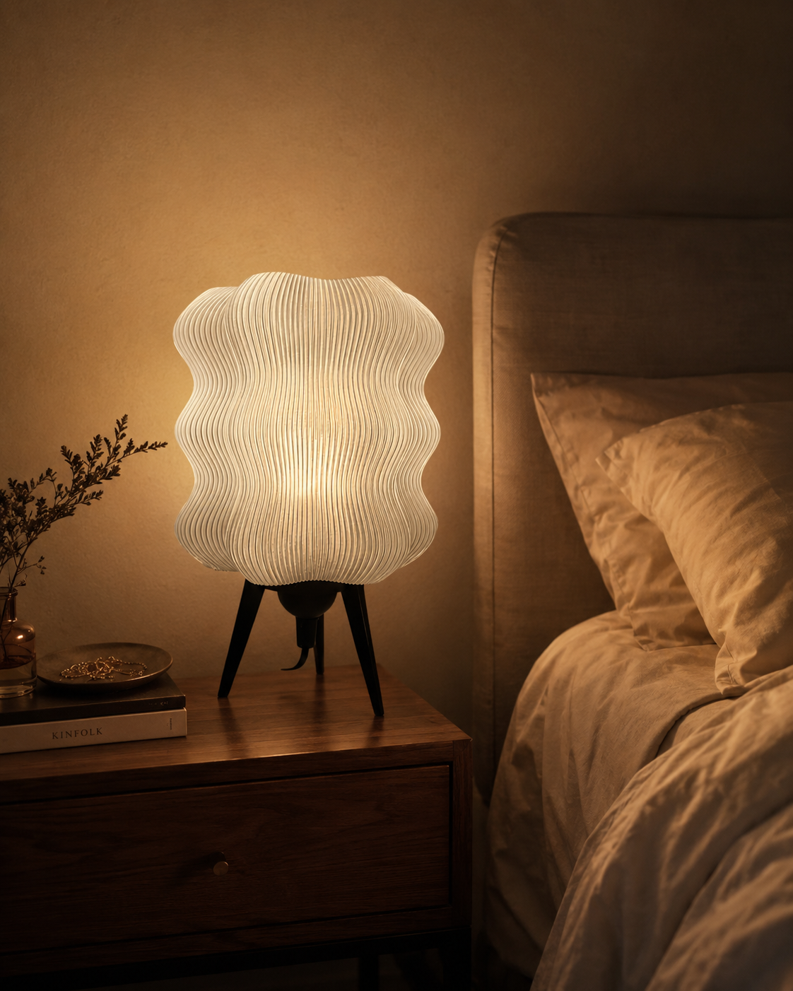 Wave Table Lamp in Matte White on a bedroom nightstand