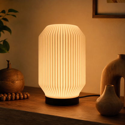 Lantern Ribbed Table Lamp in Matte White on a shelf with wooden decor