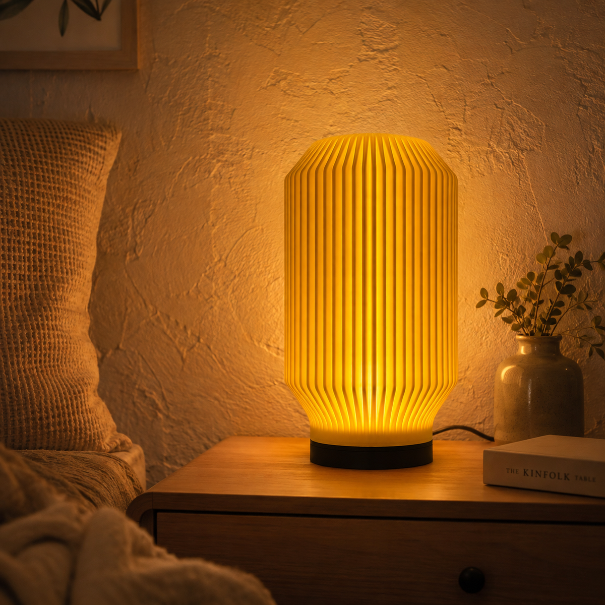 Lantern Ribbed Table Lamp in Mustard glowing on a bedroom nightstand