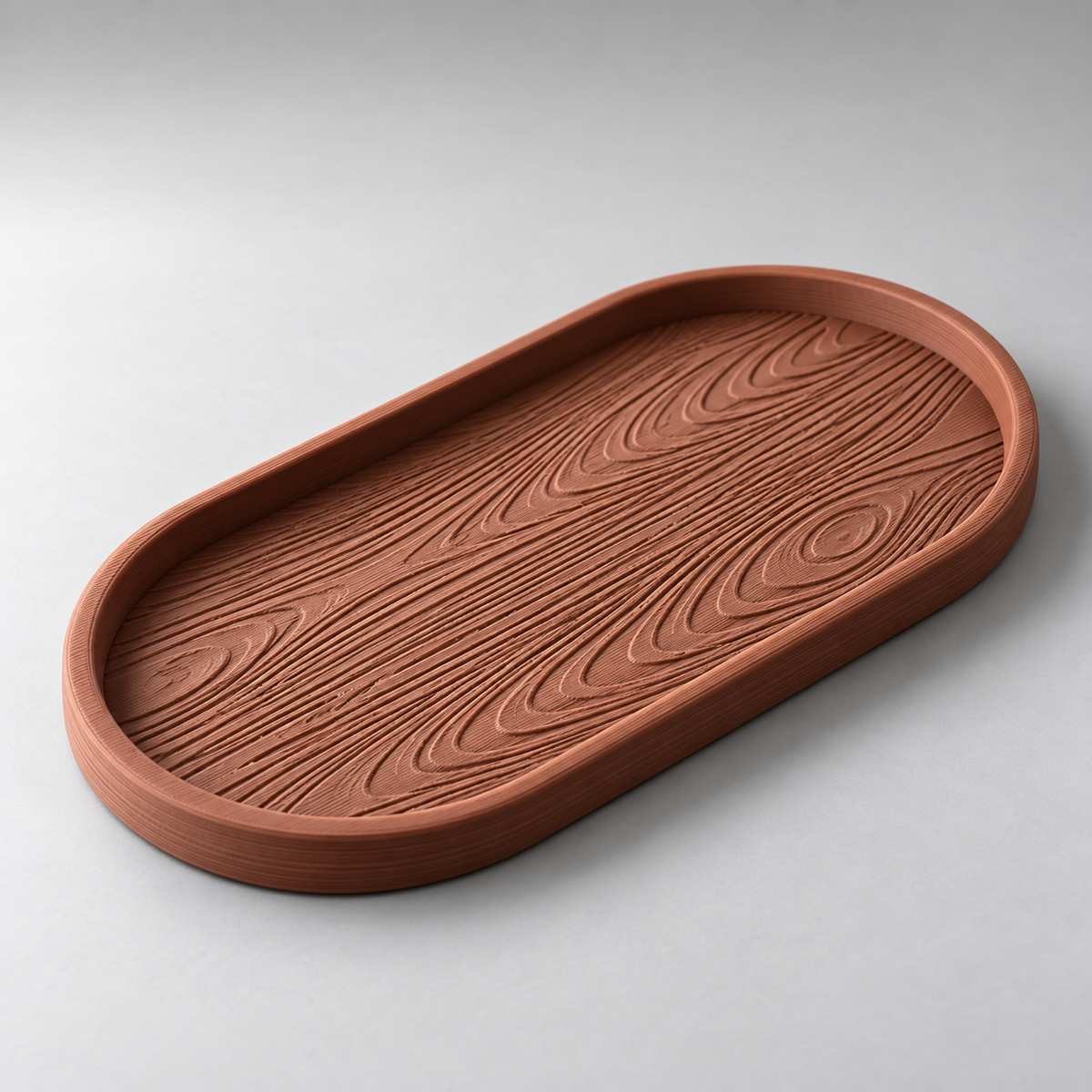 DiyArts Grain Oval Valet Tray in Burnt Rust, raised wood-grain texture, studio product shot