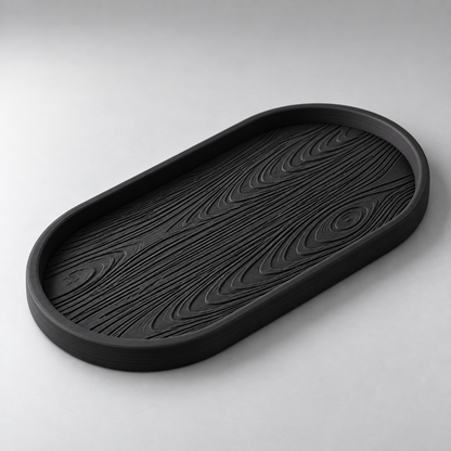 DiyArts Grain Oval Valet Tray in Matte Black, raised wood-grain texture, studio product shot