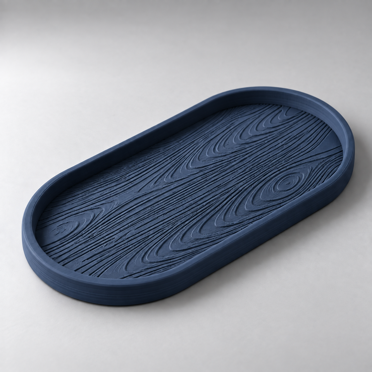 DiyArts Grain Oval Valet Tray in Deep Indigo Blue, raised wood-grain texture, studio product shot