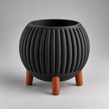 DiyArts Ribbed Planter with Legs in Matte Black with burnt rust legs, fluted mid-century plant pot, studio product shot