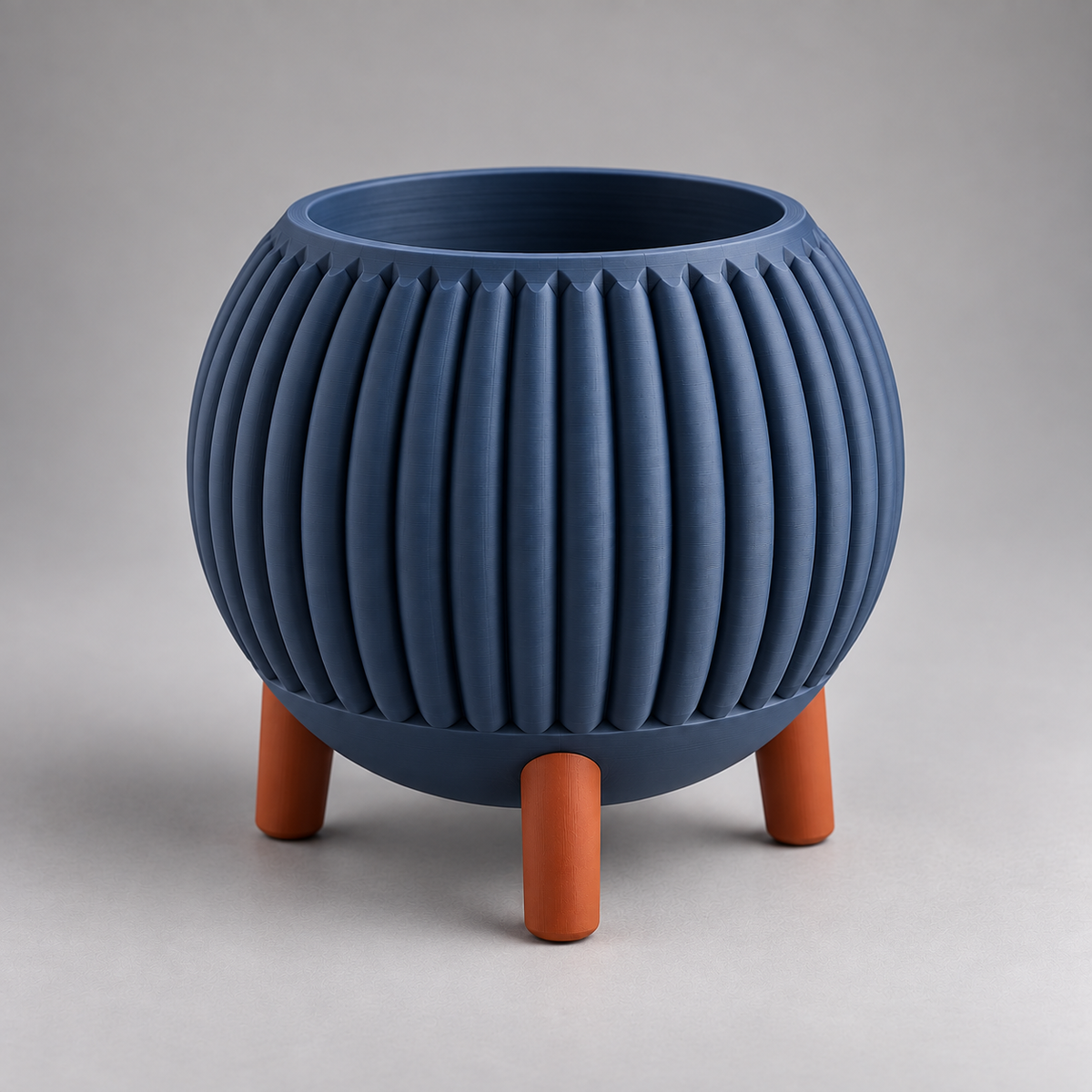 DiyArts Ribbed Planter with Legs in Deep Indigo Blue with burnt rust legs, fluted mid-century plant pot, studio product shot