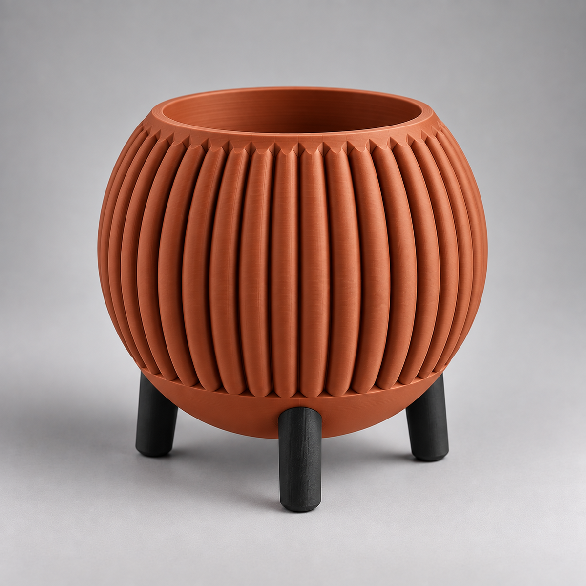 DiyArts Ribbed Planter with Legs in Burnt Rust with matte black legs, fluted mid-century plant pot, studio product shot