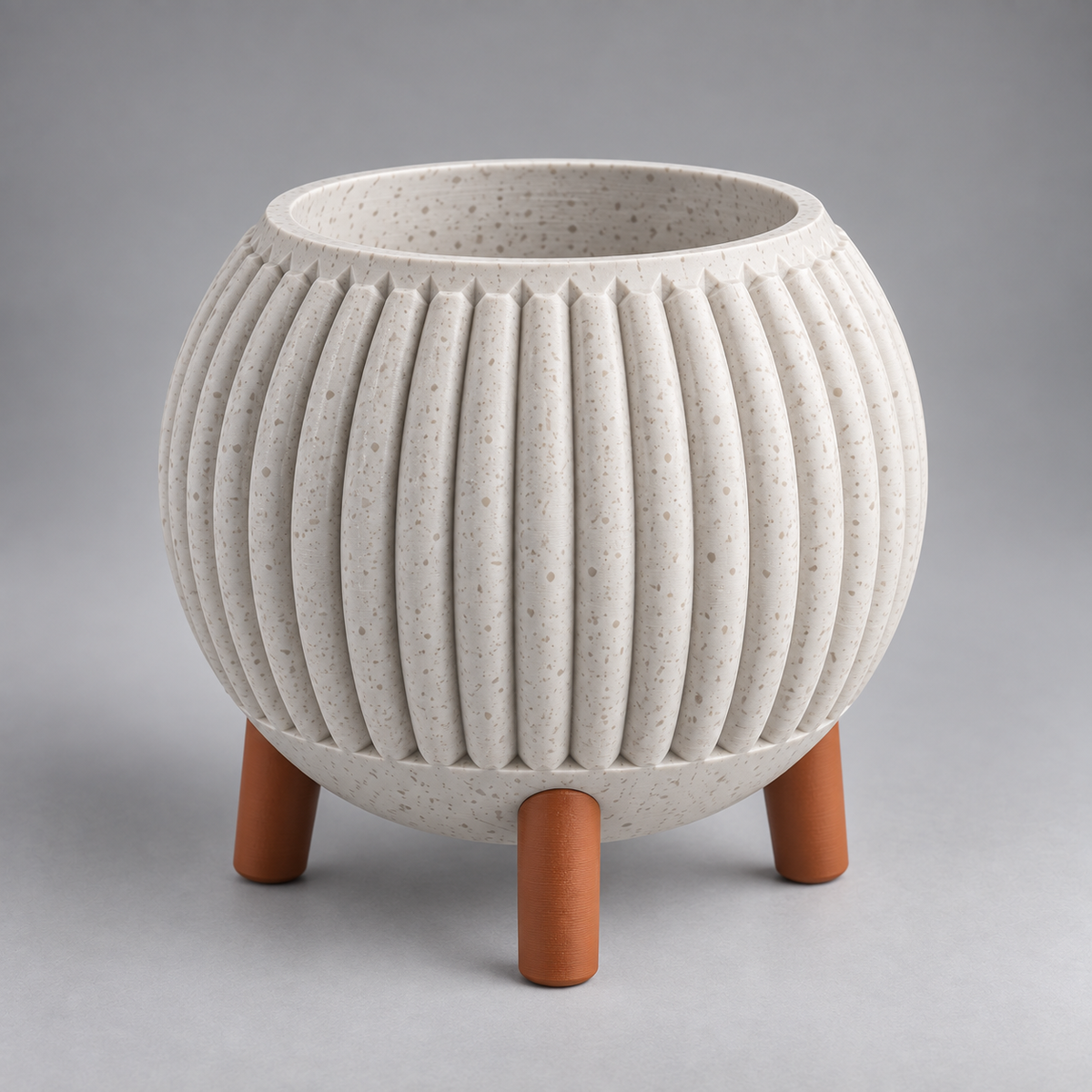 DiyArts Ribbed Planter with Legs in White Marble with burnt rust legs, speckled stone-look finish, studio product shot