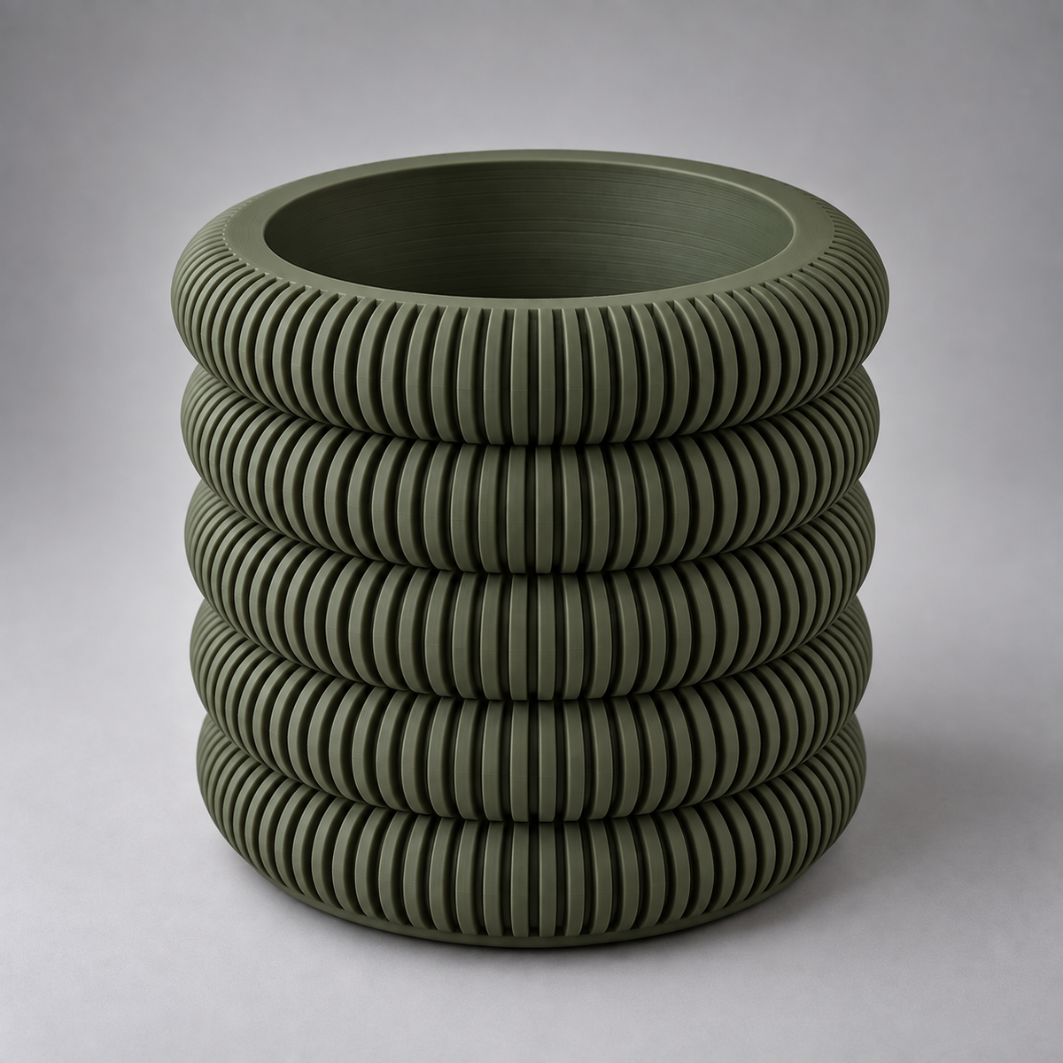 DiyArts Coin Stack Planter with Drip Tray in Moss Green, five stacked ribbed rings, studio product shot
