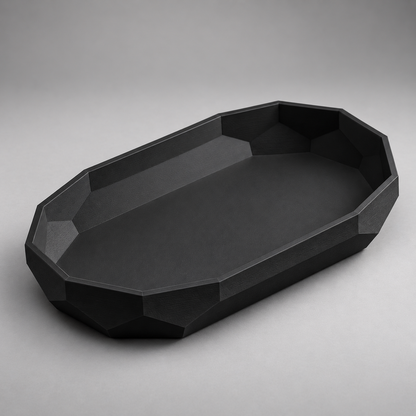 DiyArts Facet Oval Catch-All Tray in Matte Black, faceted geometric wall, studio product shot