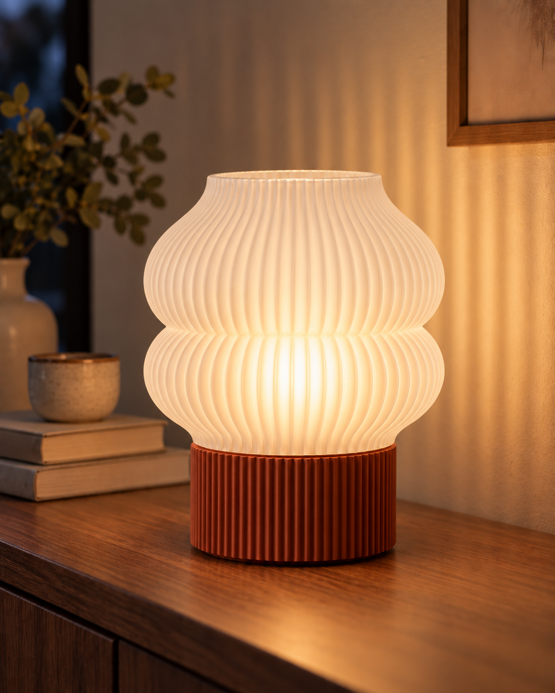 Ripple Table Lamp, Double Bubble shade in Jade White, glowing on a wooden console table