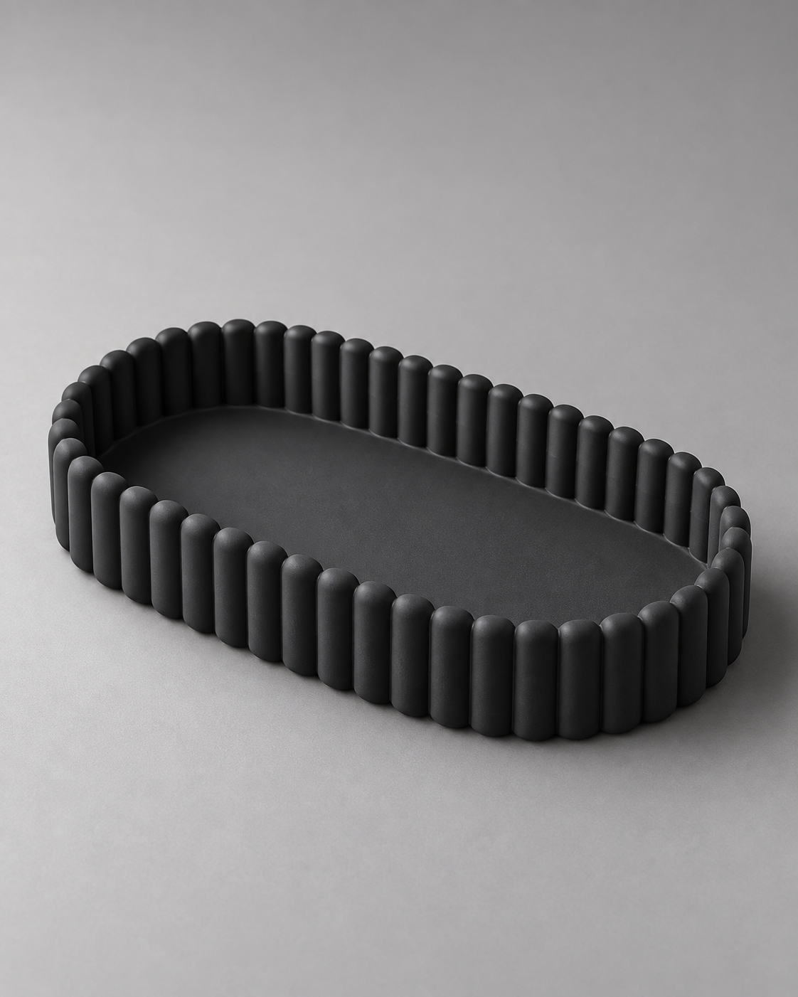 DiyArts Ripple Catch-All Tray in Matte Black, fluted oval dish, studio product shot