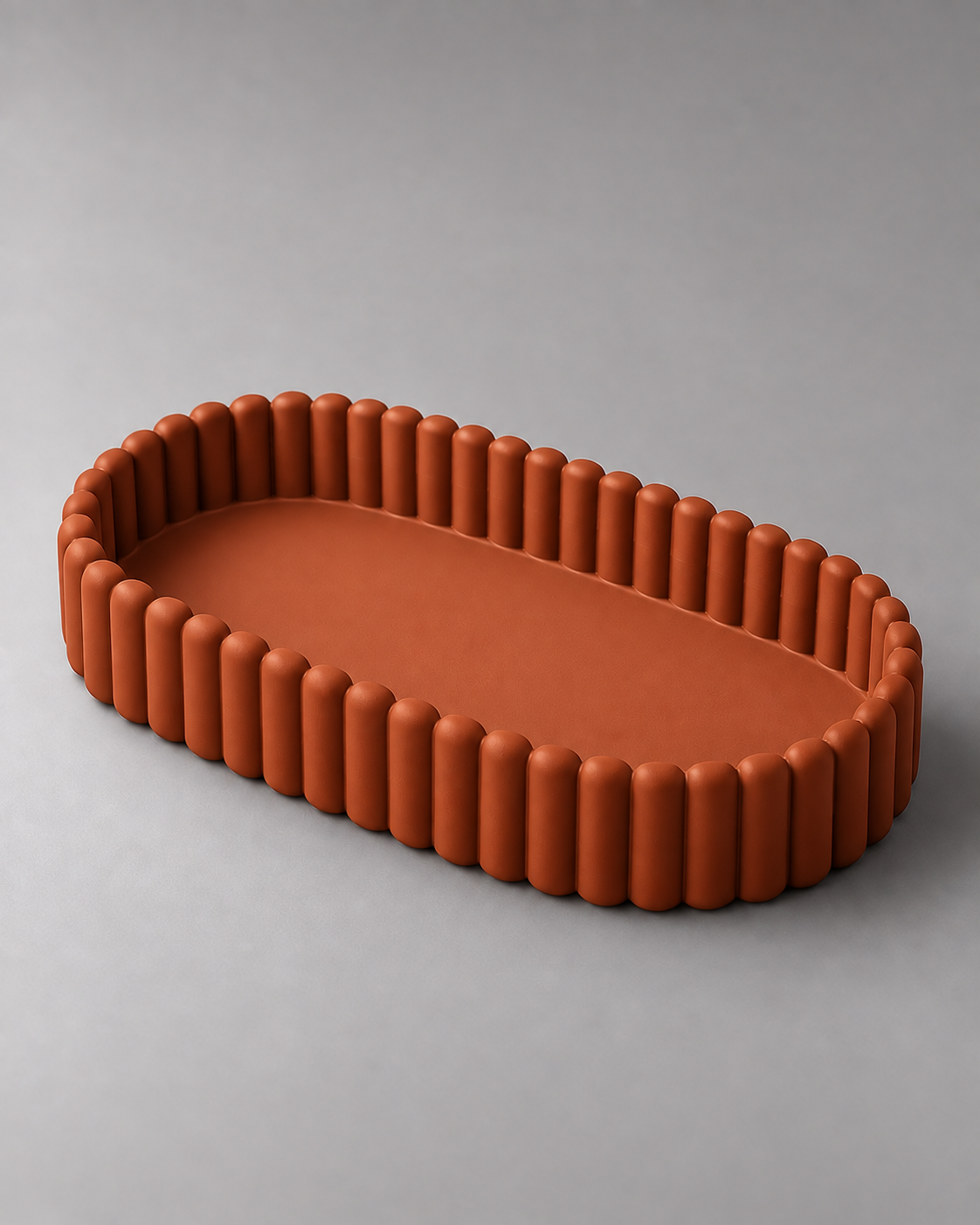 DiyArts Ripple Catch-All Tray in Burnt Rust, fluted oval dish, studio product shot