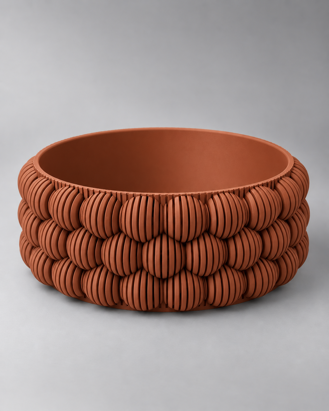 DiyArts Bubble Catch-All Bowl in Burnt Rust, ribbed bubble texture, studio product shot