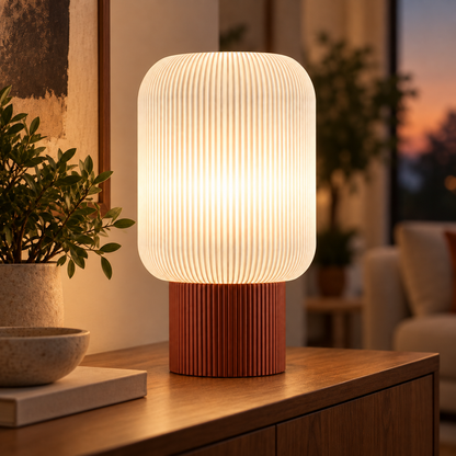Column Ribbed Table Lamp, Cylinder base in Burnt Rust, glowing on a wooden console table