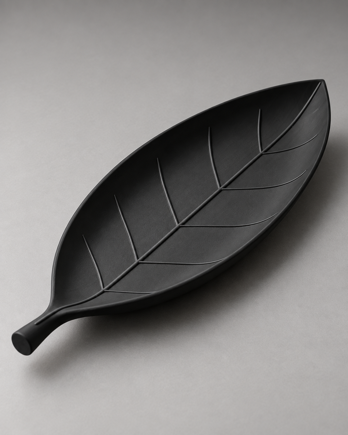 DiyArts Leaf Catch-All Tray in Matte Black, leaf-shaped dish with sculpted veins, studio product shot