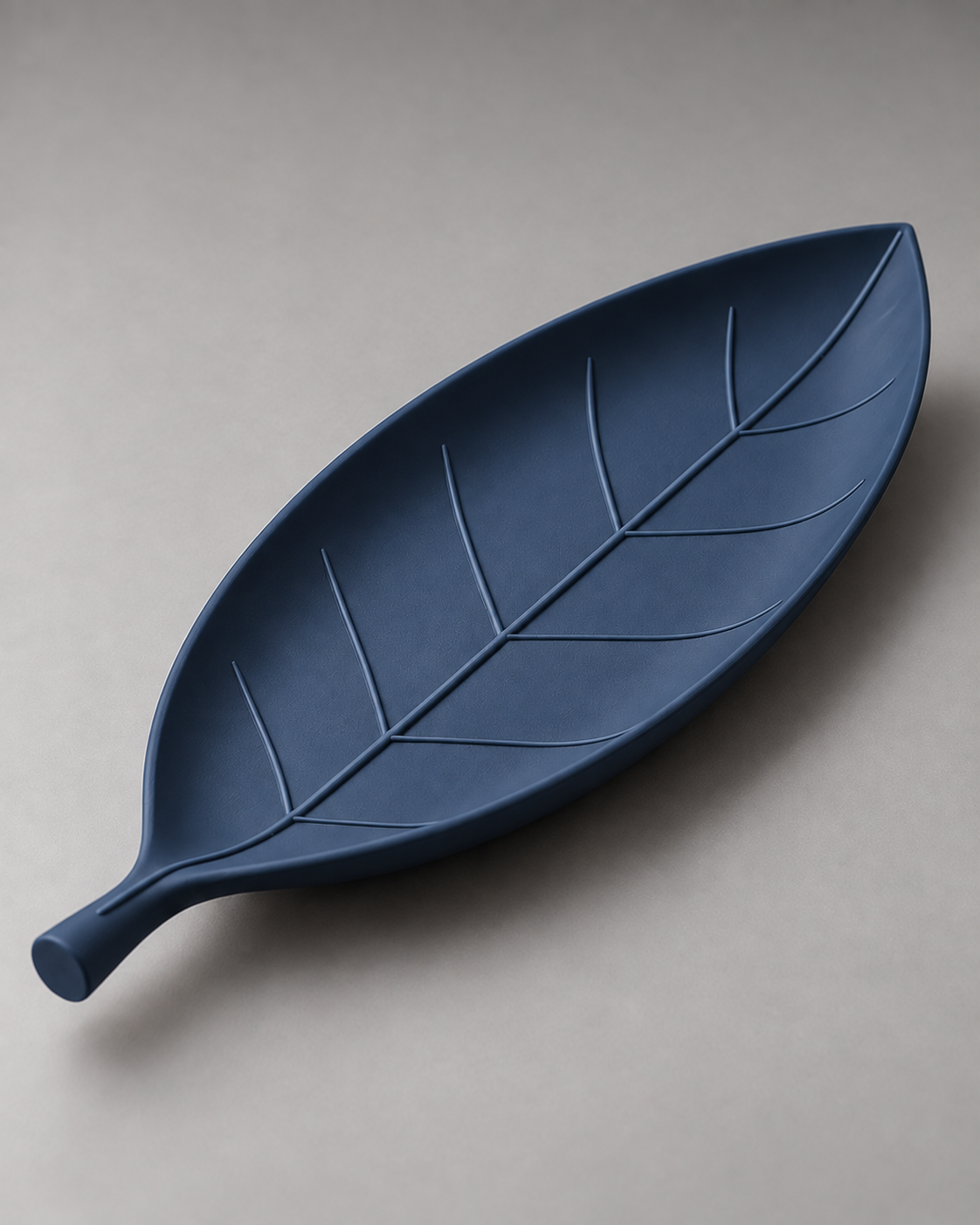 DiyArts Leaf Catch-All Tray in Deep Indigo Blue, leaf-shaped dish with sculpted veins, studio product shot
