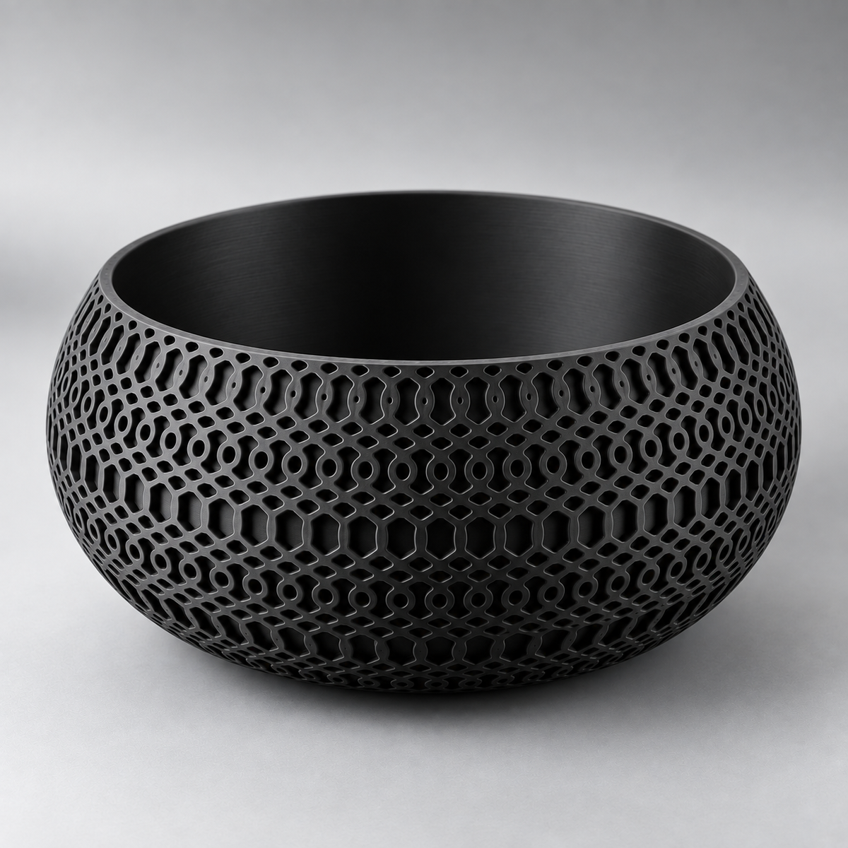 DiyArts Lattice Catch-All Bowl in Matte Black, openwork mesh lattice wall, studio product shot