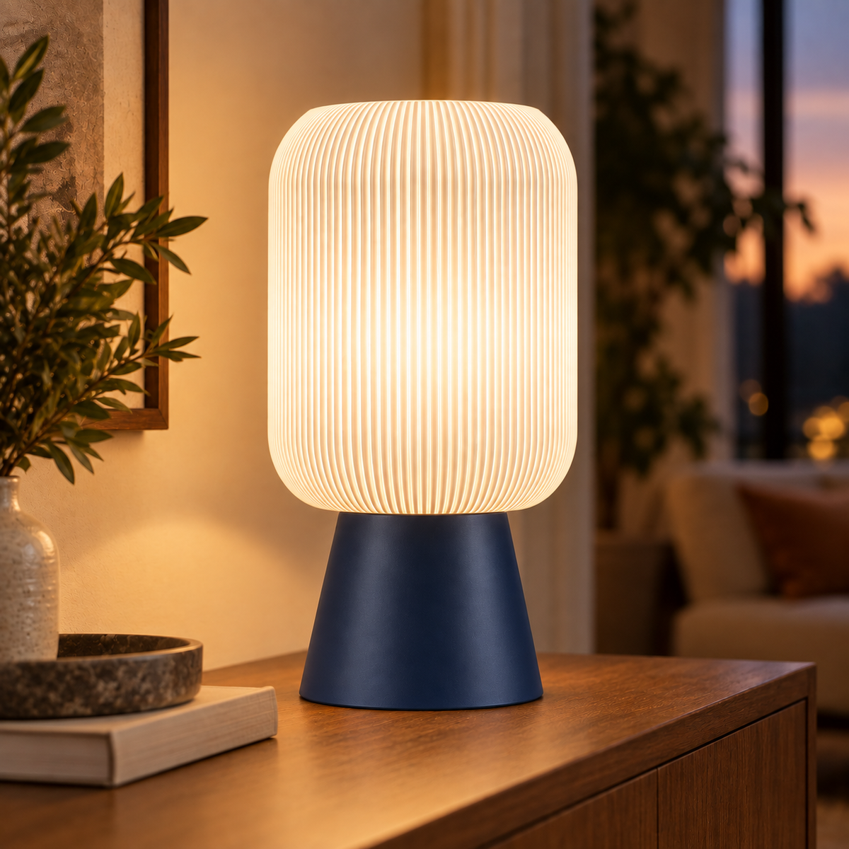 Column Ribbed Table Lamp, Cone base in Deep Indigo Blue, glowing on a wooden console table