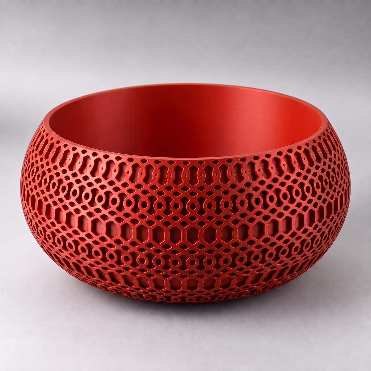 DiyArts Lattice Catch-All Bowl in Red, satin semi-gloss finish, openwork mesh lattice wall, studio product shot