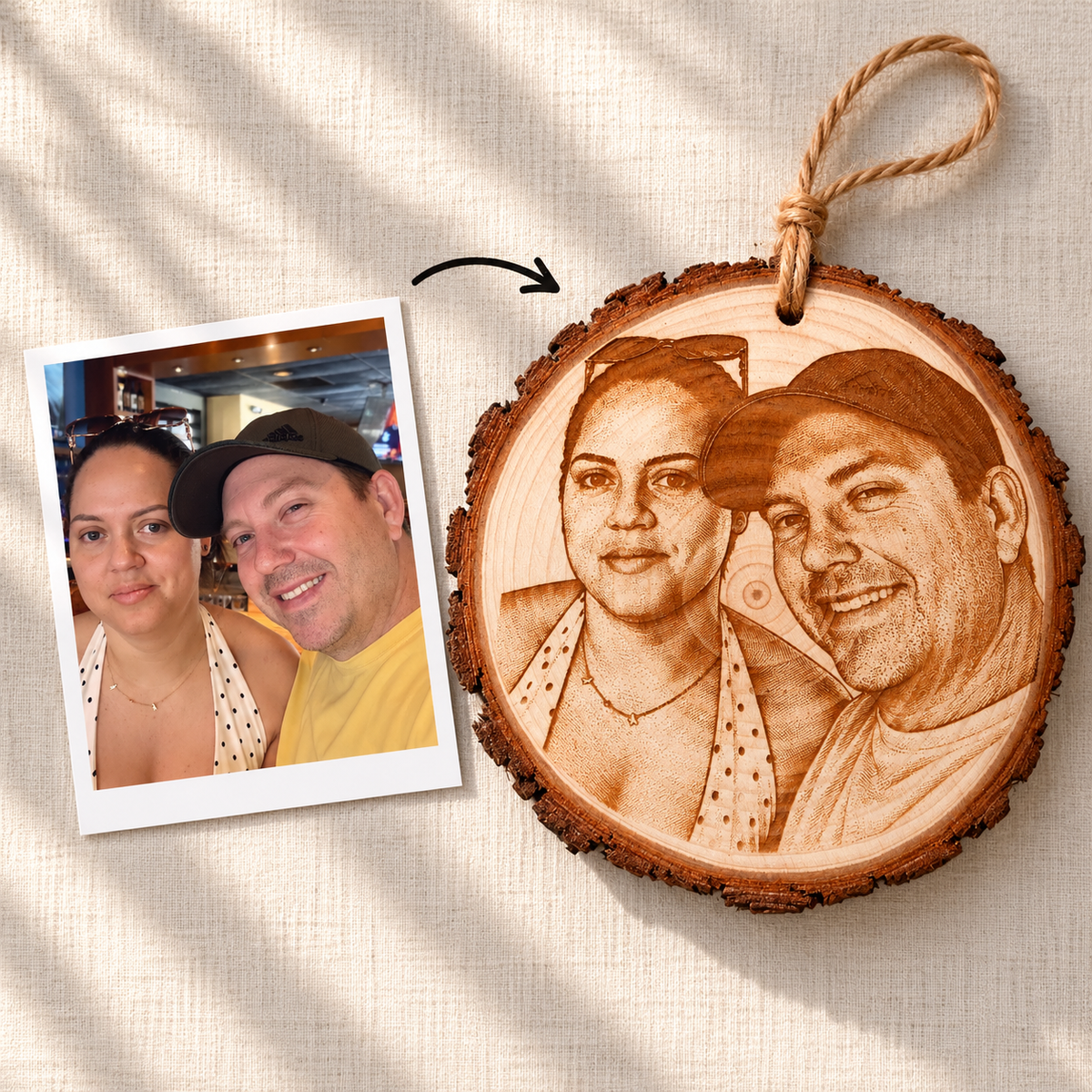 Customer photo of a couple next to the finished photo engraved pine wood slice with jute twine