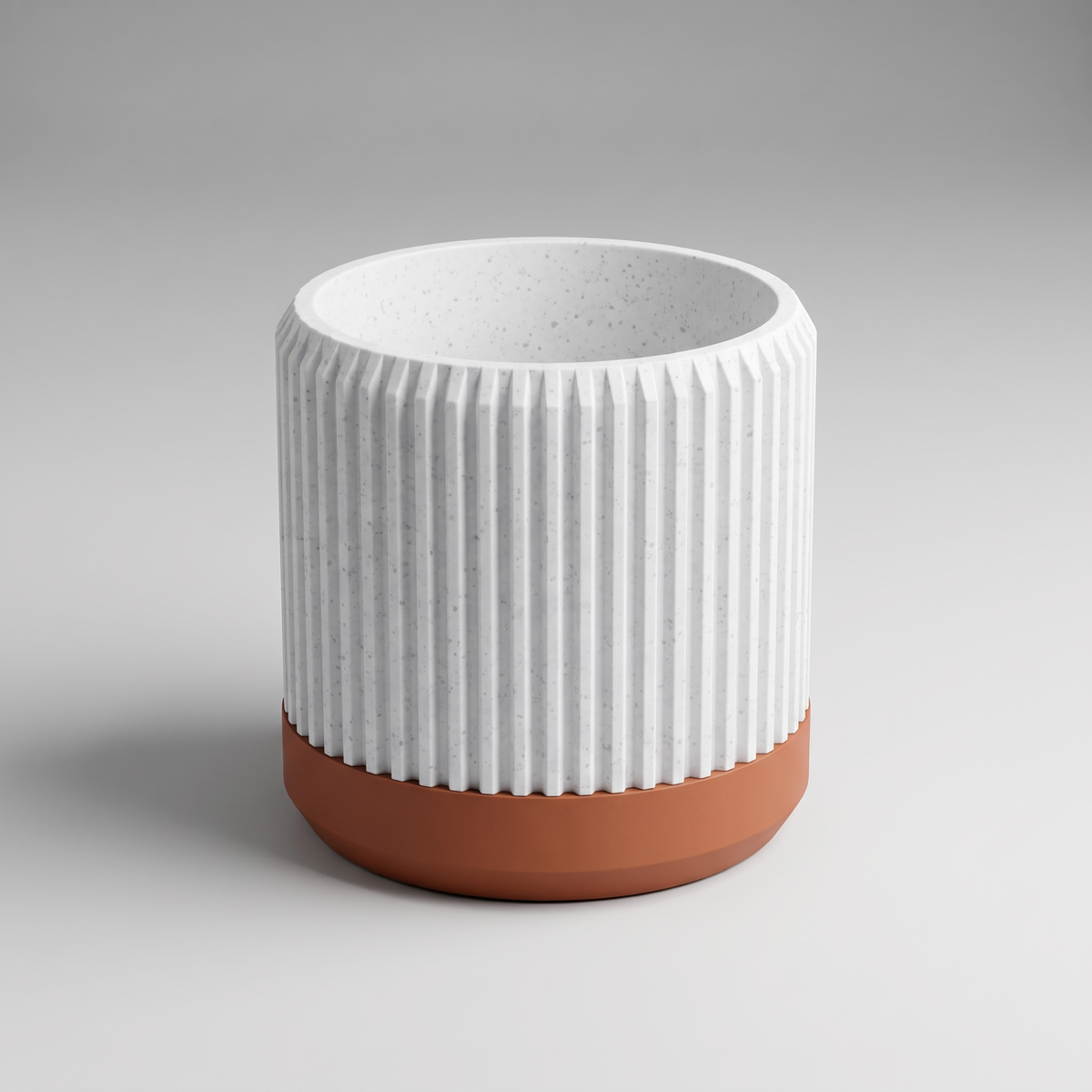 DiyArts Fluted Cylinder Planter with Saucer in White Marble with burnt rust saucer, speckled stone-look finish, studio product shot