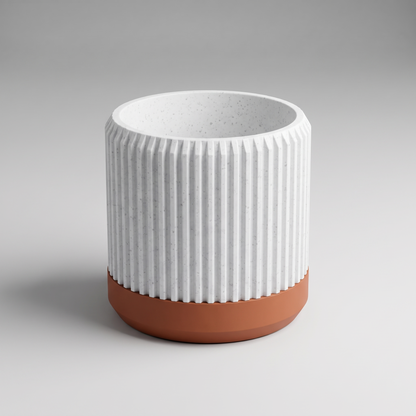 DiyArts Fluted Cylinder Planter with Saucer in White Marble with burnt rust saucer, speckled stone-look finish, studio product shot