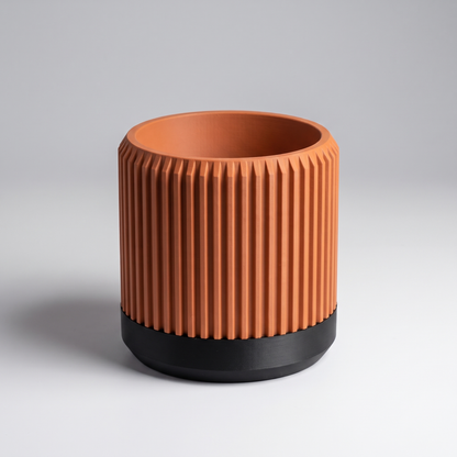 DiyArts Fluted Cylinder Planter with Saucer in Burnt Rust with matte black saucer, ribbed 4 inch plant pot, studio product shot