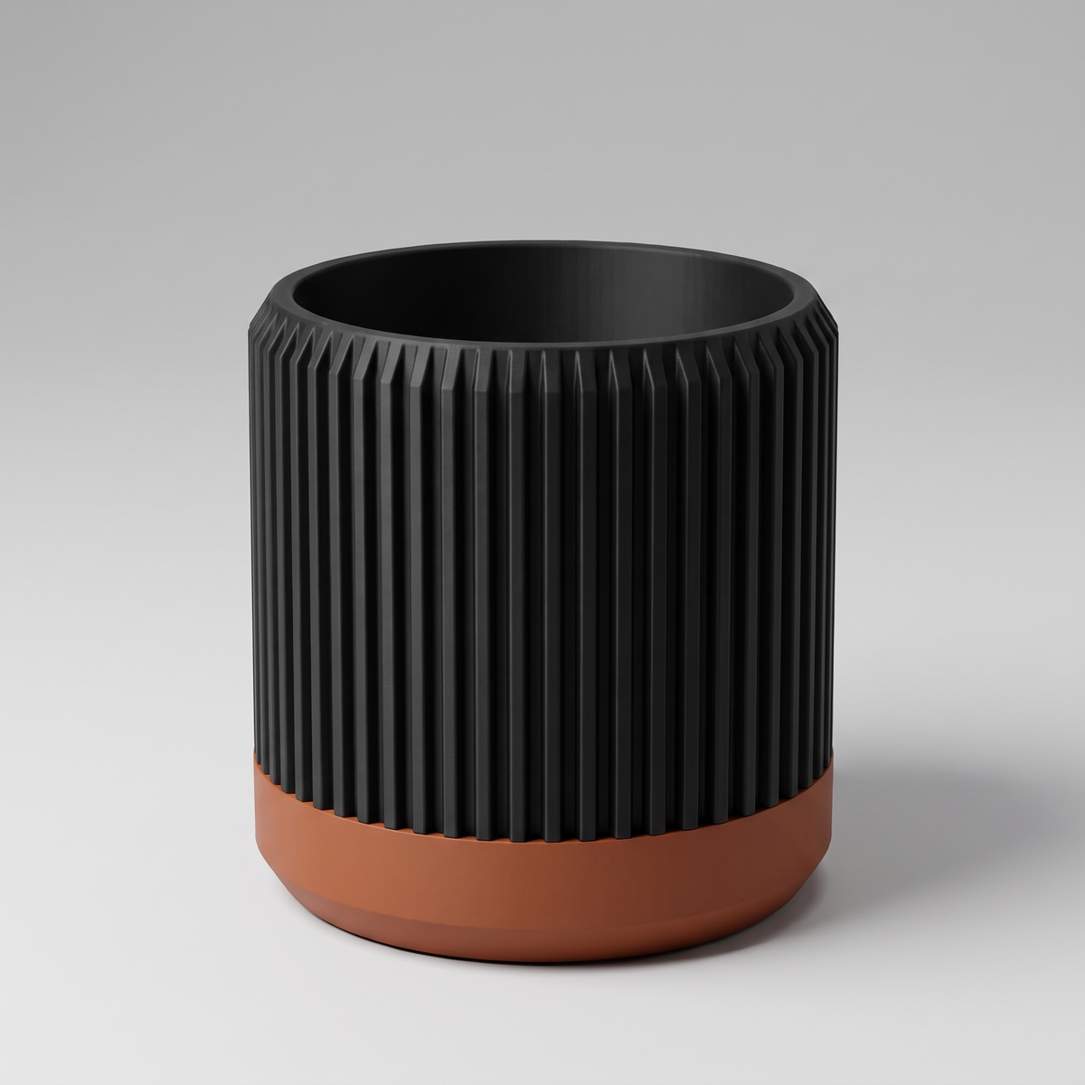 DiyArts Fluted Cylinder Planter with Saucer in Matte Black with burnt rust saucer, ribbed 4 inch plant pot, studio product shot