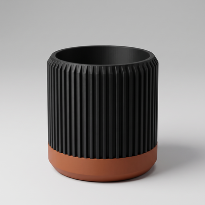 DiyArts Fluted Cylinder Planter with Saucer in Matte Black with burnt rust saucer, ribbed 4 inch plant pot, studio product shot