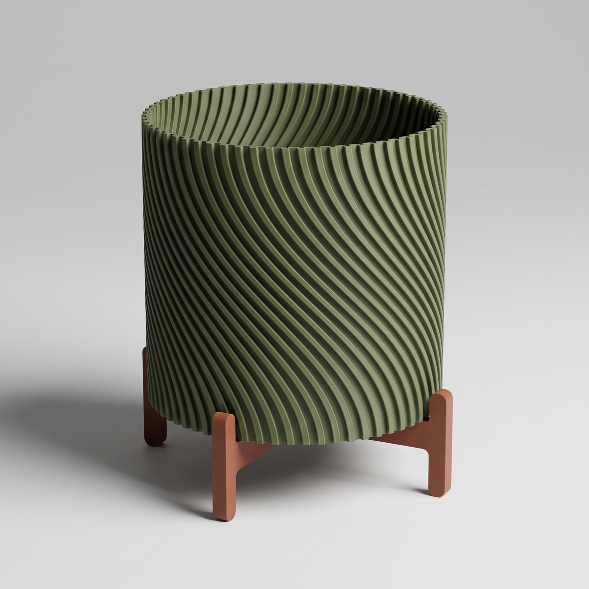 DiyArts Twisted Planter with Stand in Moss Green with burnt rust cross stand, 4 inch spiral ribbed plant pot, studio product shot