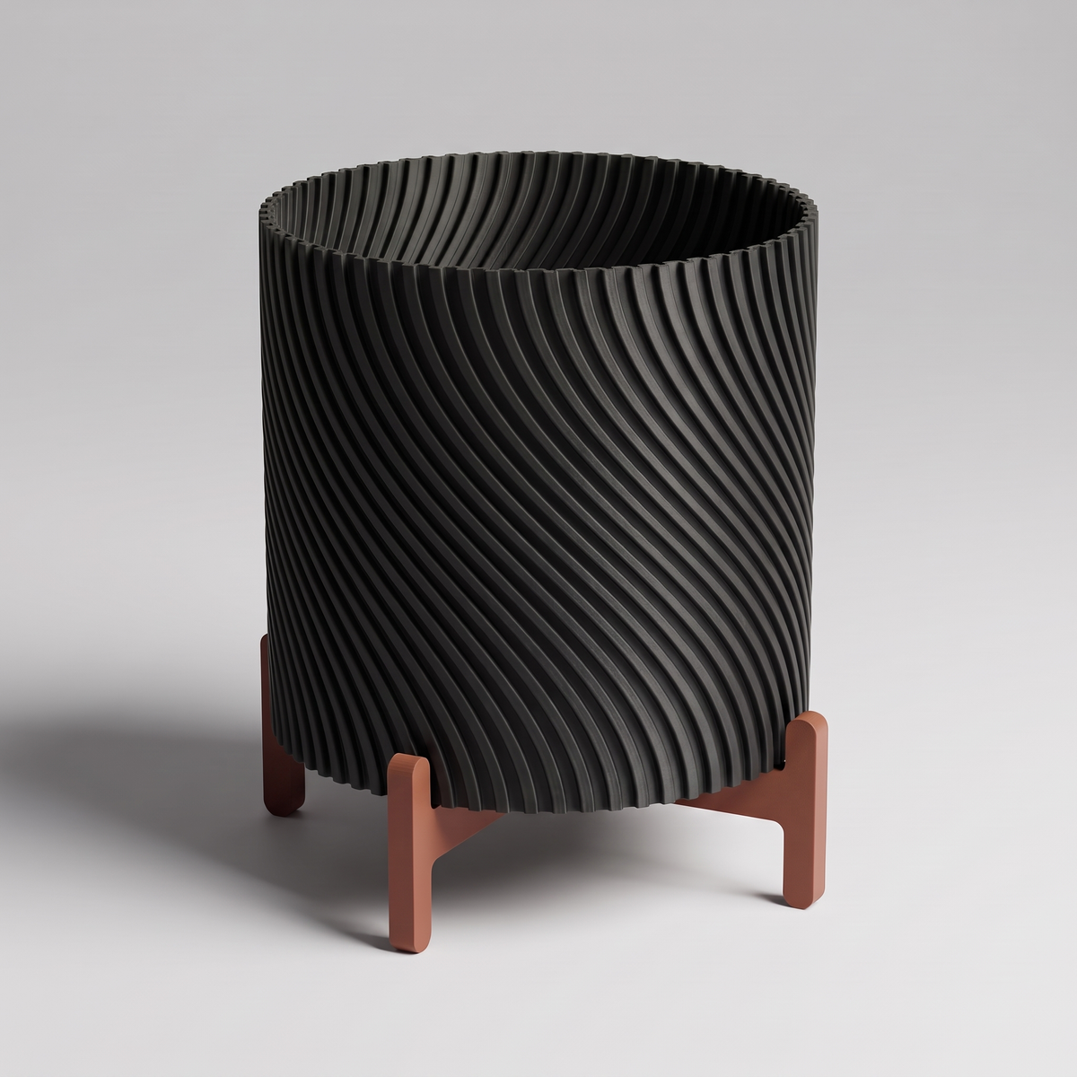 DiyArts Twisted Planter with Stand in Matte Black with burnt rust cross stand, 4 inch spiral ribbed plant pot, studio product shot