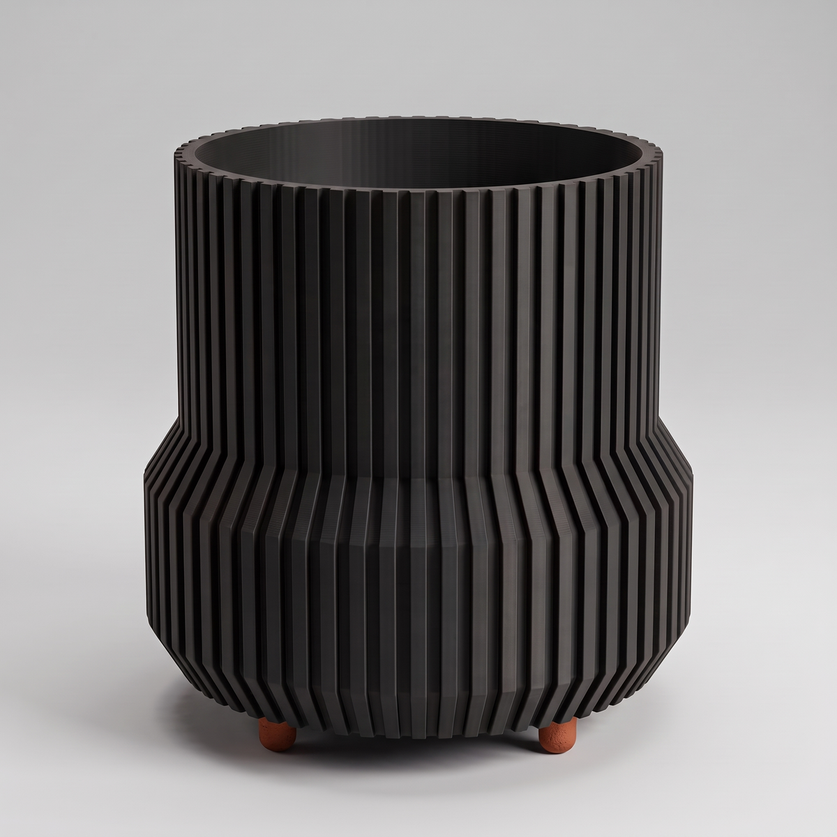 DiyArts Chubby Fluted Planter with Feet in Matte Black with burnt rust feet, stepped ribbed 4.5 inch plant pot, studio product shot