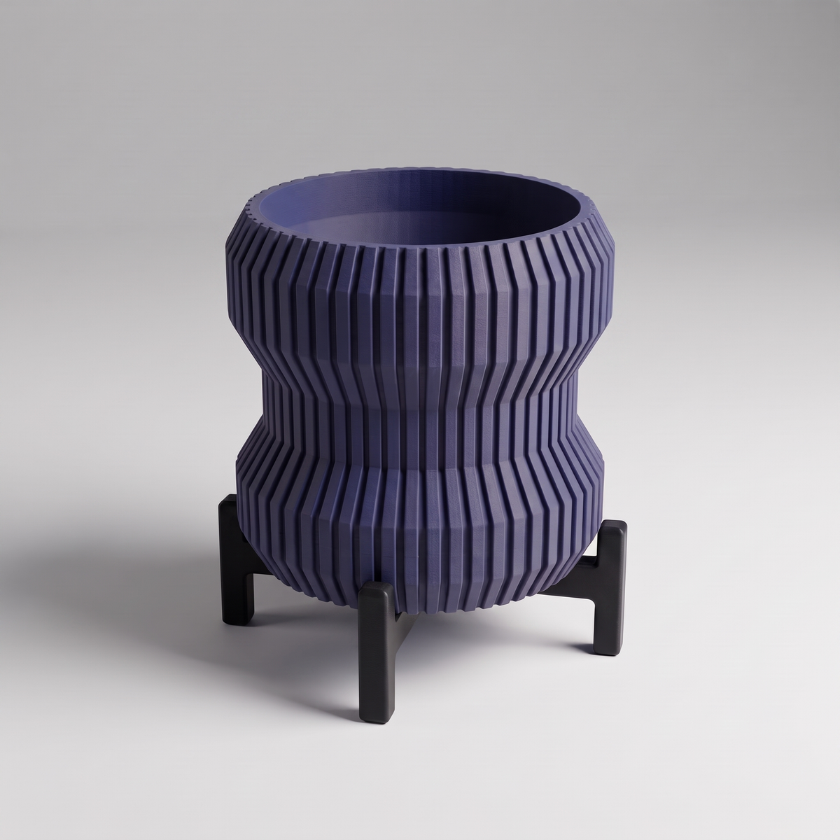 DiyArts Waisted Fluted Planter with Stand in Deep Indigo Blue with matte black cross stand, 5 inch hourglass ribbed plant pot, studio product shot