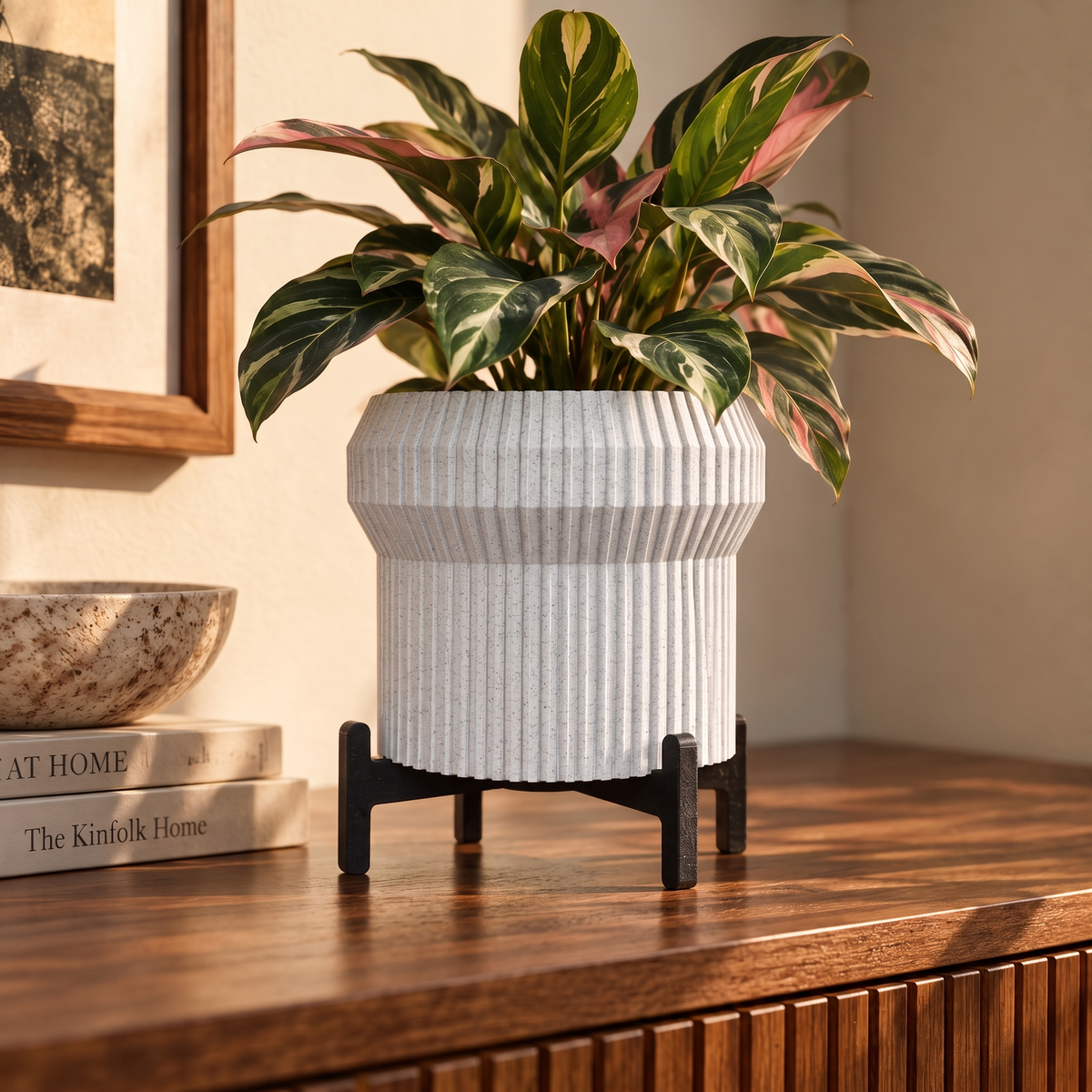 Flared Fluted Planter in White Marble holding a calathea on a walnut sideboard
