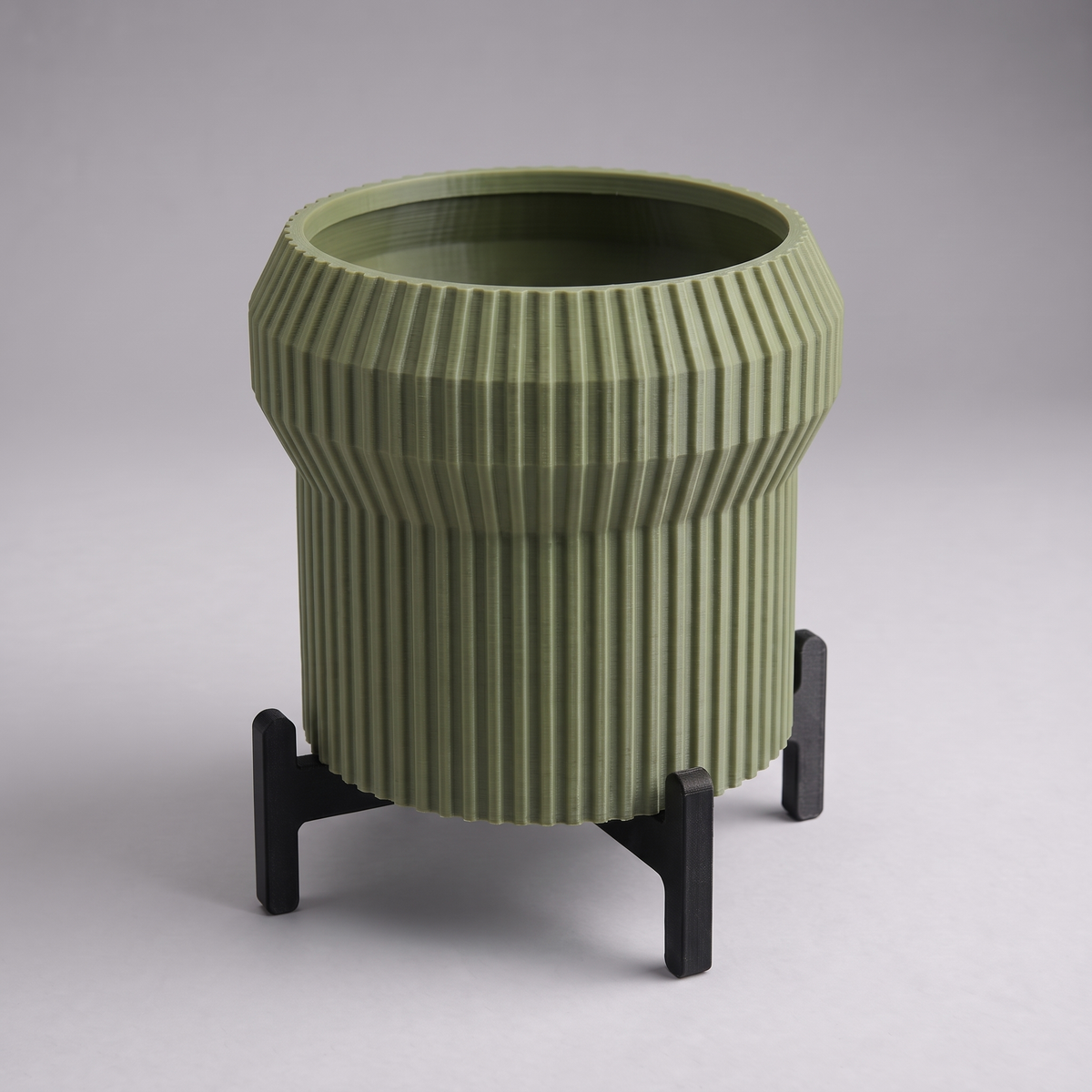 DiyArts Flared Fluted Planter with Stand in Moss Green with matte black cross stand, 5 inch ribbed plant pot, studio product shot