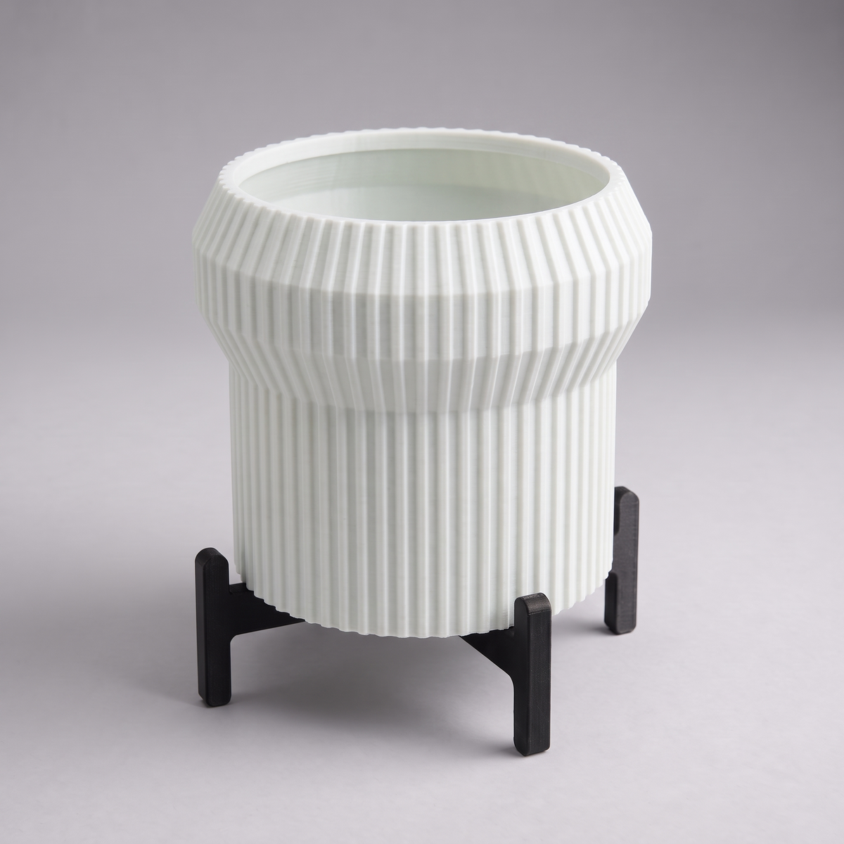 DiyArts Flared Fluted Planter with Stand in Jade White with matte black cross stand, 5 inch ribbed plant pot, studio product shot