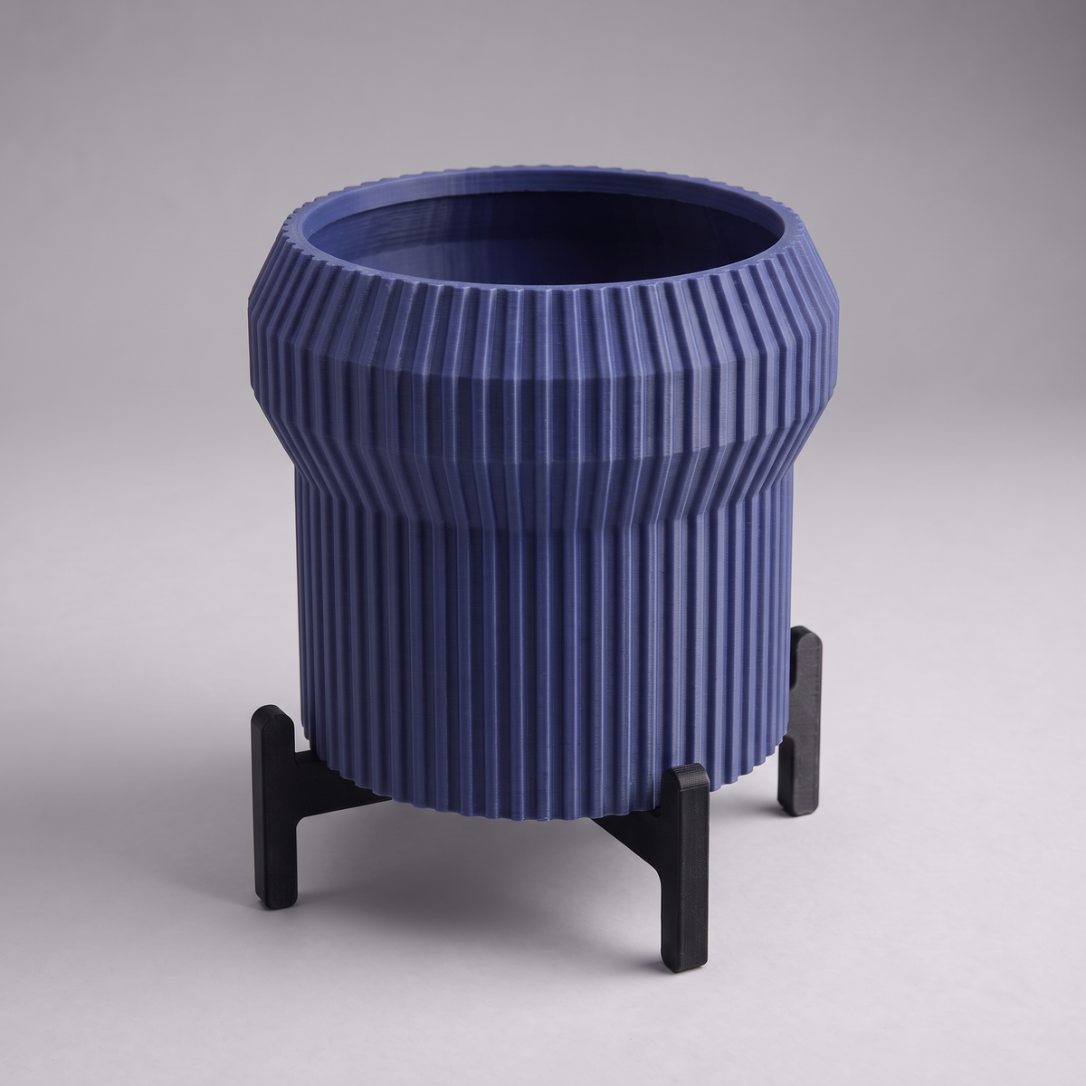 DiyArts Flared Fluted Planter with Stand in Deep Indigo Blue with matte black cross stand, 5 inch ribbed plant pot, studio product shot