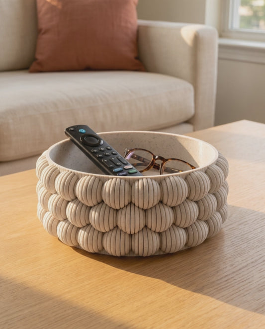 Slow orbit around the DiyArts Bubble Catch-All Bowl in White Marble on an oak coffee table, showing the ribbed bubble texture of the 3D printed bowl