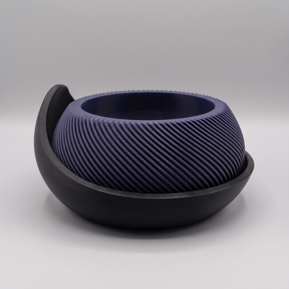Swirl Ribbed Bowl Planter with Cradle Saucer in Deep Indigo Blue with a Matte Black saucer, studio view