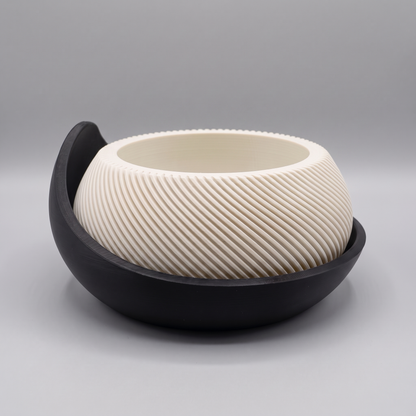 Swirl Ribbed Bowl Planter with Cradle Saucer in Jade White with a Matte Black saucer, studio view